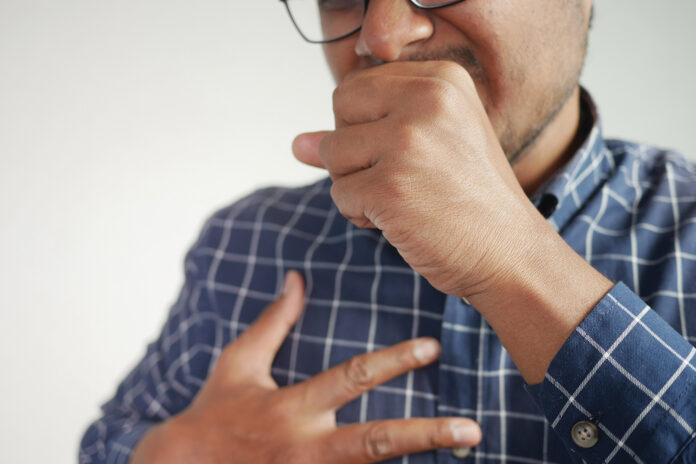 Sick man got flu allergy sneezing and blowing nose